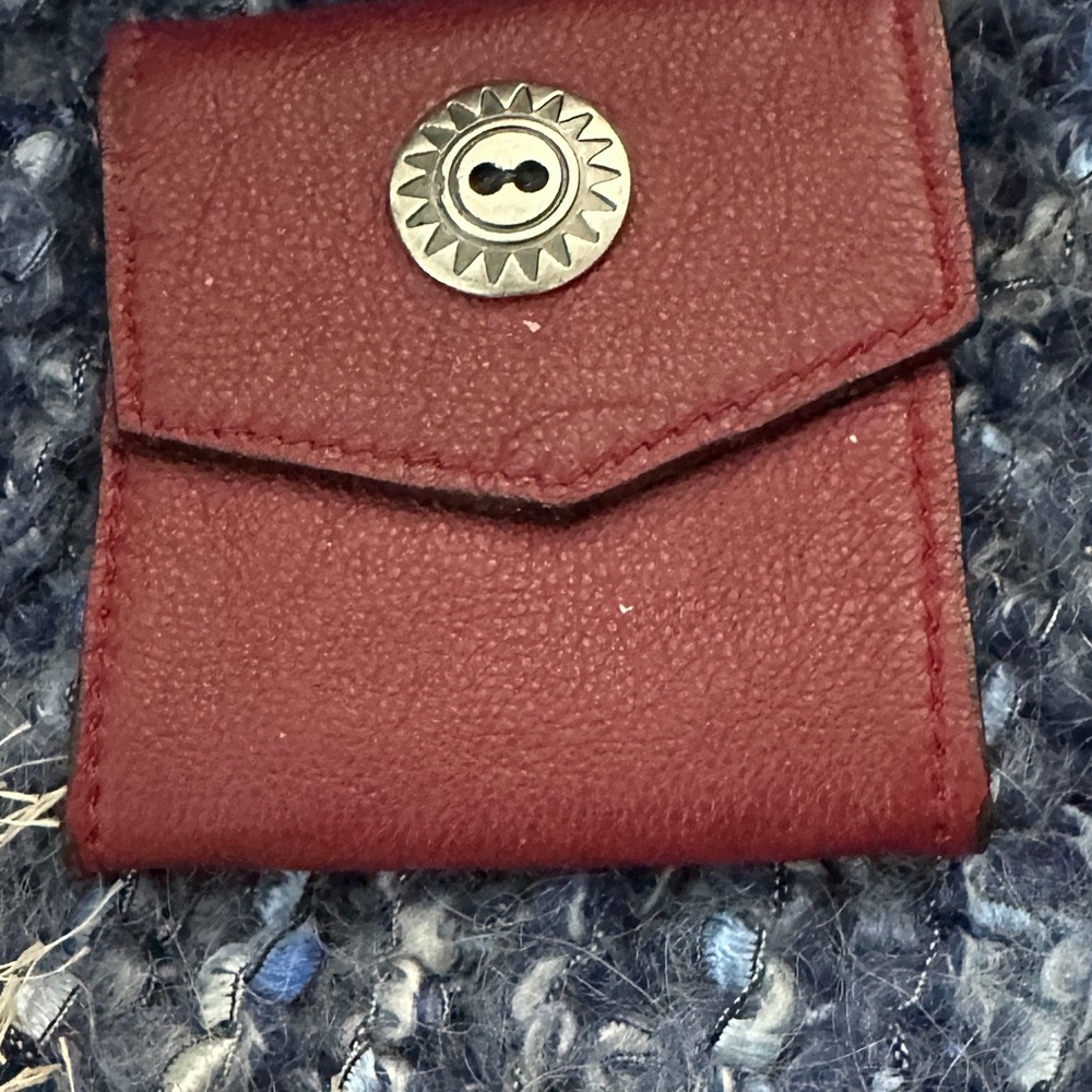 Red and White Leather cord cover for the phone and the other products.